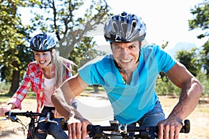 Young couple on country bike ride