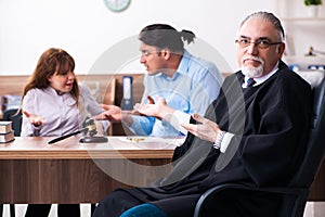 Young couple in the courthouse in divorce concept