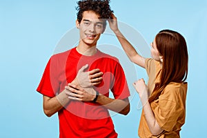 young couple cropped view studio blue background communication