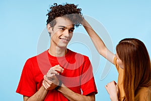 young couple cropped view studio blue background communication