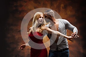 Young couple dances Caribbean Salsa photo