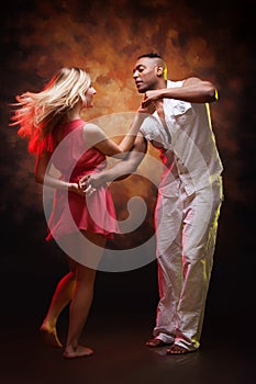 Young couple dances Caribbean Salsa photo