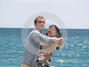 Young Couple Dancing on Beach