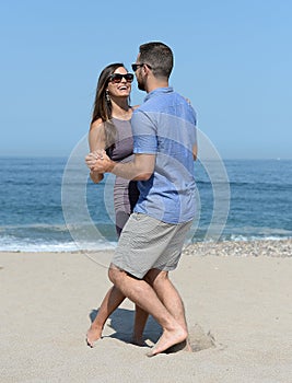 Young couple dancing on beach