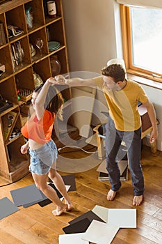 Young couple dancing to vinyl records