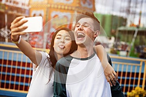 Young Couple Date Amusement Park Concept
