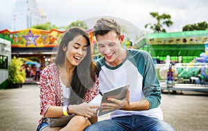 Young Couple Date Amusement Park Concept