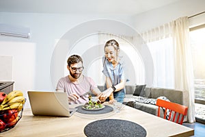 Young couple dinning in the living room