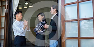 Young couple disagrees with real estate agent who is giving them a tour around a home, showing all the room and telling