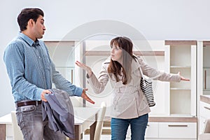 The young couple disappointed with price in furniture store