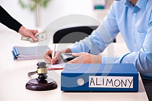 Young couple divorcing in alimony concept
