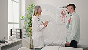 Young couple doctor and patient having medical consultation at clinic