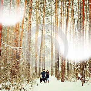 Young Couple with a Dog Having Fun in Winter