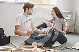 Young couple doing apartment repair together themselves