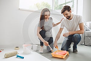 Young couple doing apartment repair together themselves