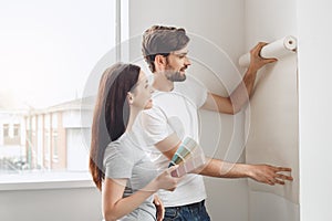 Young couple doing apartment repair together themselves