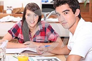 Young couple doing coursework