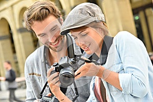 Young couple doing photo reportage photo