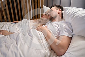 Young couple is dozing in the honeymoon suite