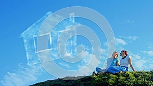 Young couple dreaming on the hill