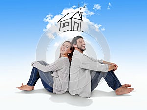 Young couple dreaming and imaging their new house in real state