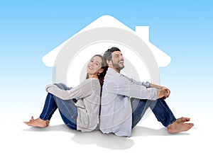 Young couple dreaming and imaging their new house in real state concept