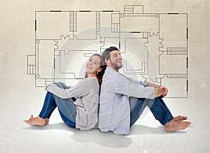 Young couple dreaming and imaging their new house in real state concept