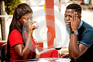 A young couple drinking red wine