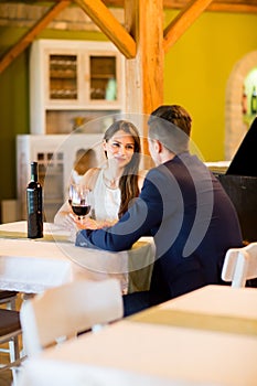 Young couple drinking red wine