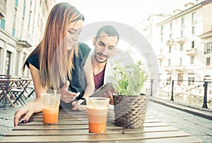 Young couple drinking a vegan shake in a bar.