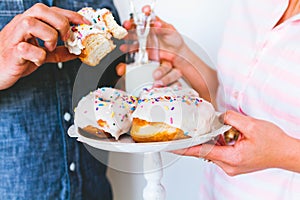 Young couple eating donuts