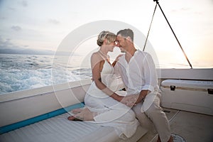 Young couple elope on boat photo