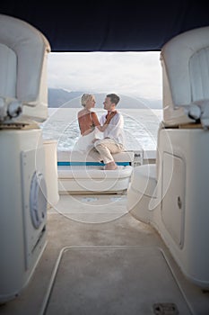 Young couple elope on boat photo