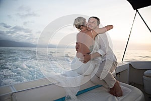 Young couple elope on boat photo