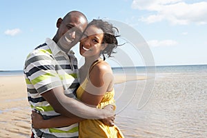 Young Couple Embracing On Beach