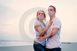 Young couple embracing on beach