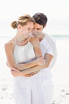 Young couple embracing on the beach