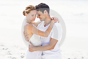 Young couple embracing on the beach