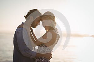 Young couple embracing at beach