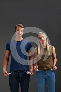 Young Couple With Empty Pockets And No Money