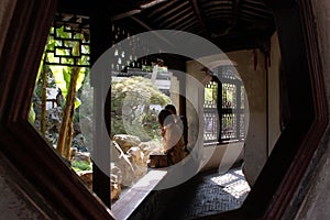Young couple engaging in a meaningful conversation in a traditional, wooden-framed building