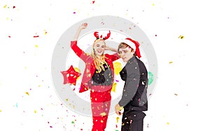 Young couple enjoy with colorful confetti in new year celebration party