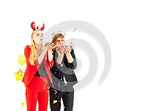 Young couple enjoy with colorful confetti in new year celebration party