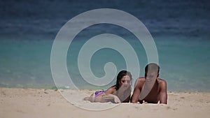 Young couple enjoy a summer beach vacation