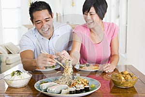 Young Couple Enjoying Chinese Food