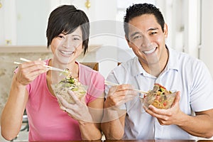 Young Couple Enjoying Chinese Food