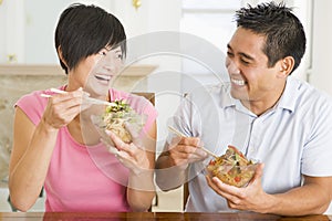 Young Couple Enjoying Chinese Food