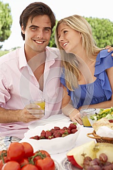 Young Couple Enjoying Outdoor Meal Together