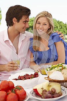 Young Couple Enjoying Outdoor Meal Together