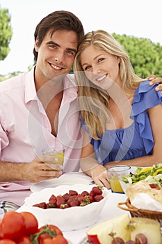 Young Couple Enjoying Outdoor Meal Together